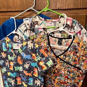 Four scrub tops.